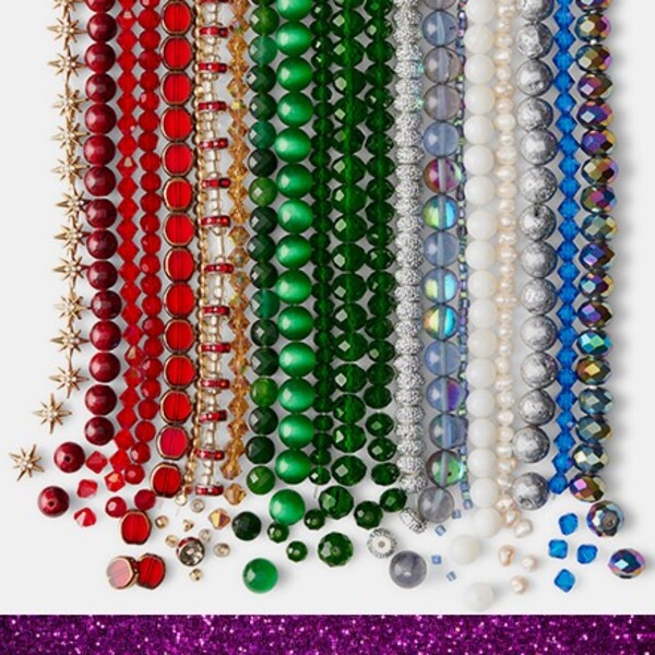 assorted beads lined up in rainbow order